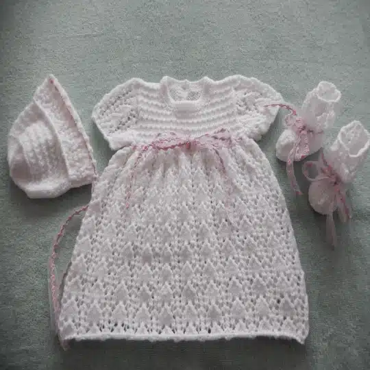 Lacy baby Dress with fancy ribbon knitting pattern