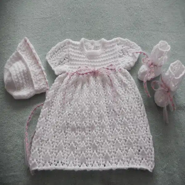 Lacy baby Dress with fancy ribbon knitting pattern